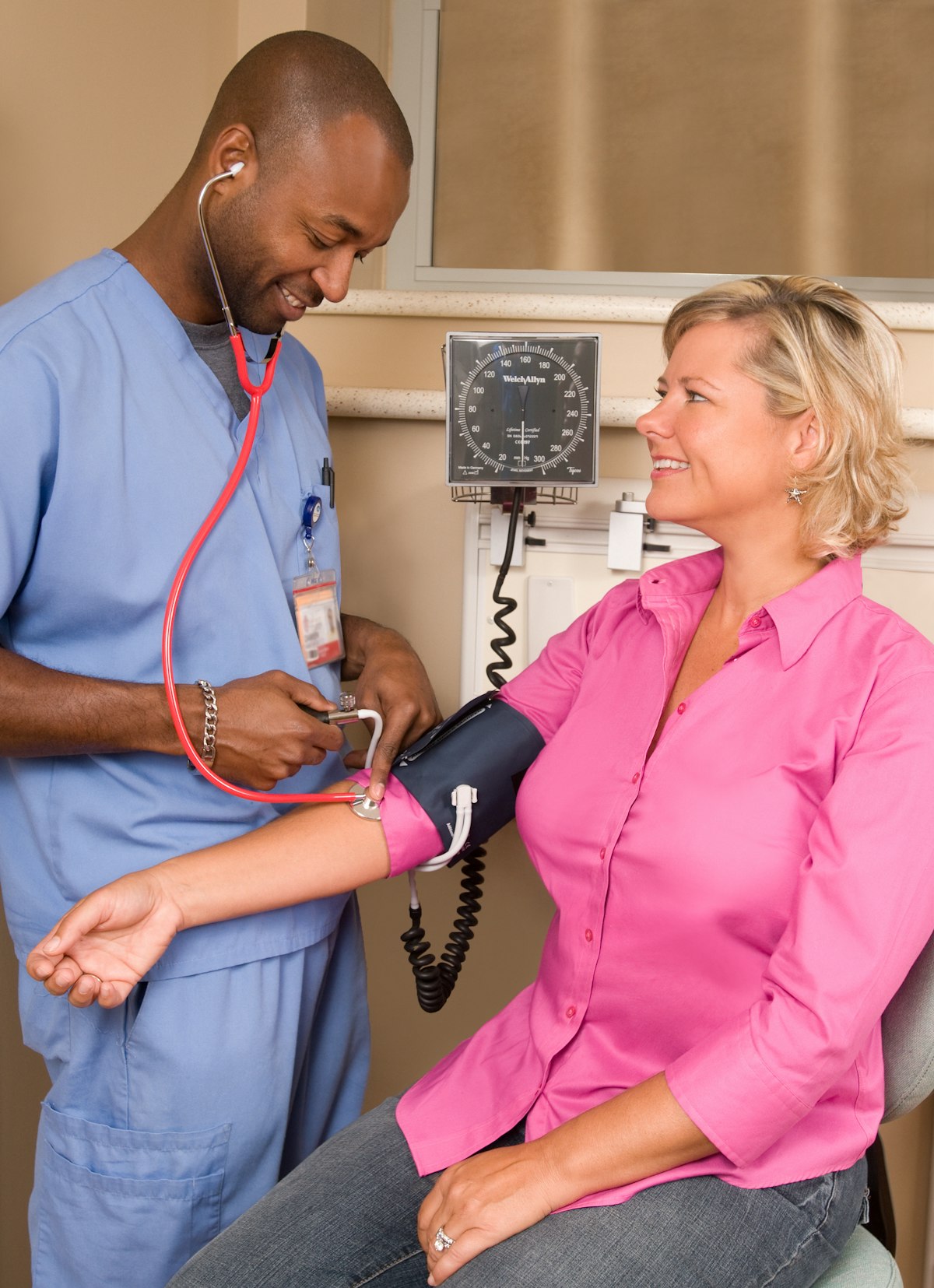 A nurse monitoring a patient for chronic disease management